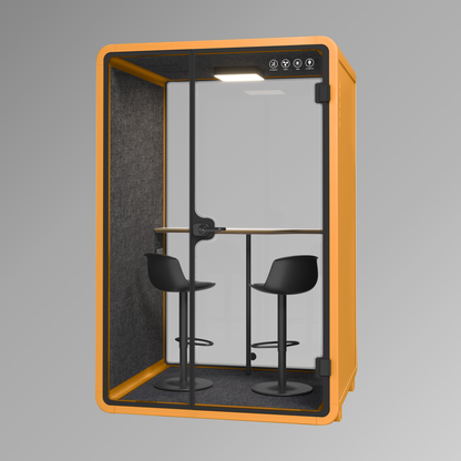 Office pod with orange frame, black interior, and two stools on a gray background