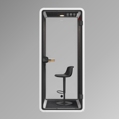 Modern phone booth with a black stool inside on a gray background
