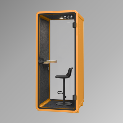 Orange phone booth with a black chair inside on a gray background